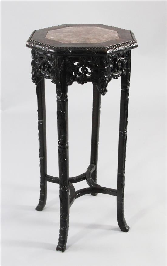 A Chinese rosewood octagonal jardiniere stand, W.1ft 2.5in. H.2ft 8in.